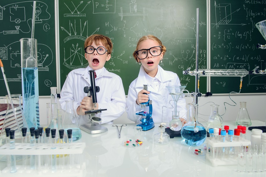 Engineering experiments in a lab coat and safety goggles