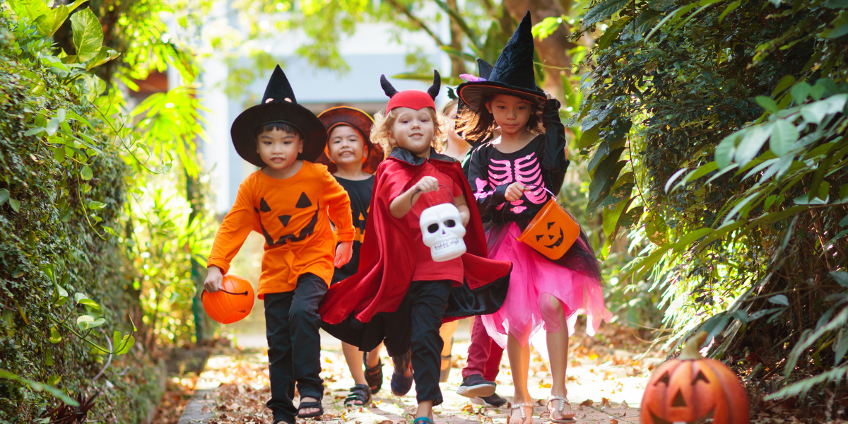 Kids having fun in costumes on Halloween