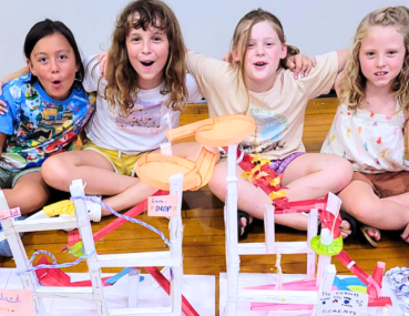 Team of Kids Celebrating STEM Project Success