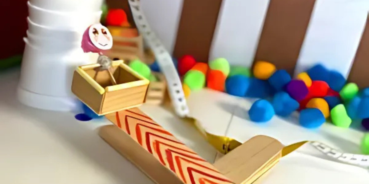 Homemade catapult showcasing fun and educational science-based activities for kids and moms. This Mother's Day engineering project teaches children about design principles and projectile motion through engaging hands-on experimentation.